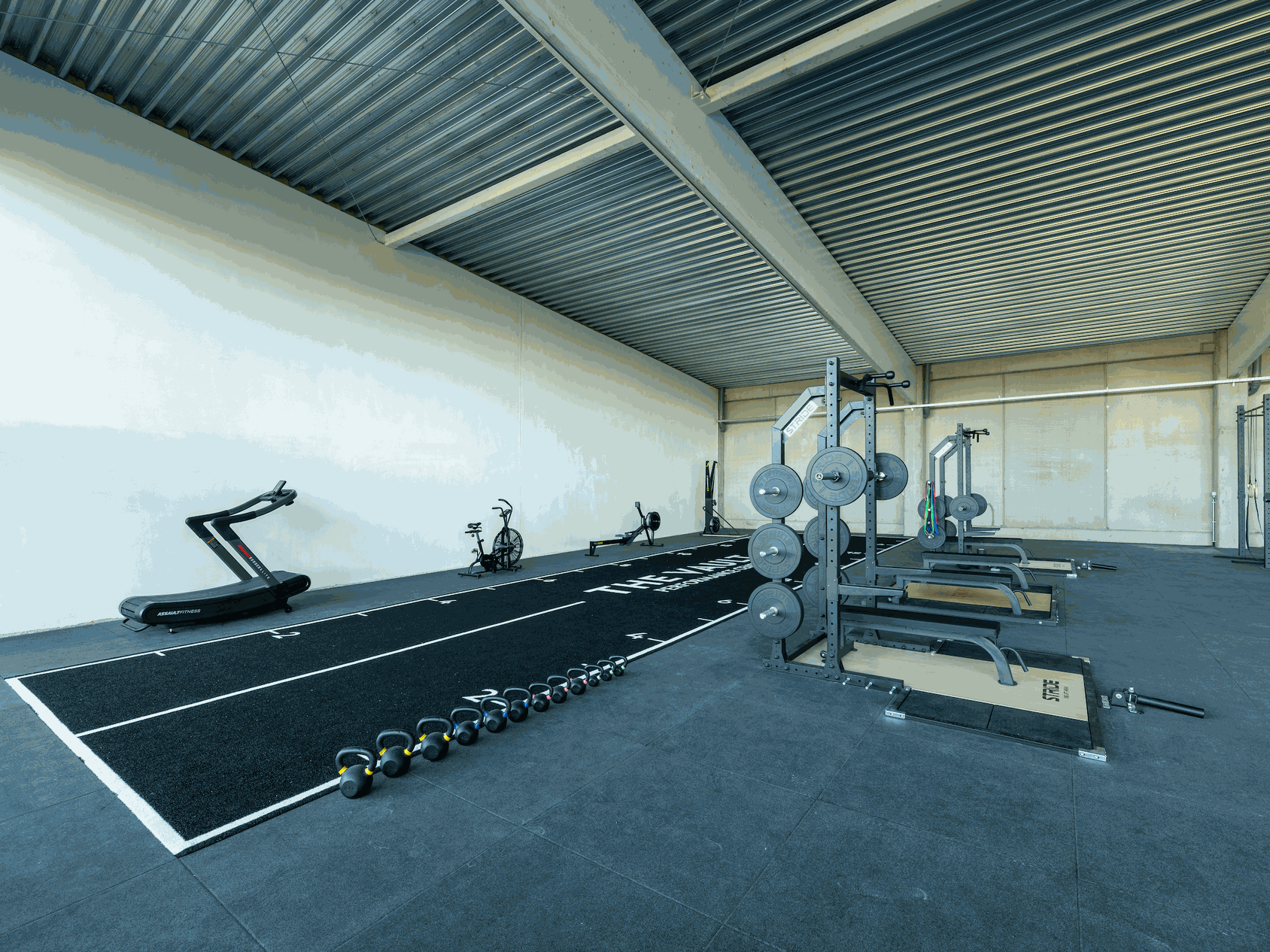 weight training and cardio workout machines in gym